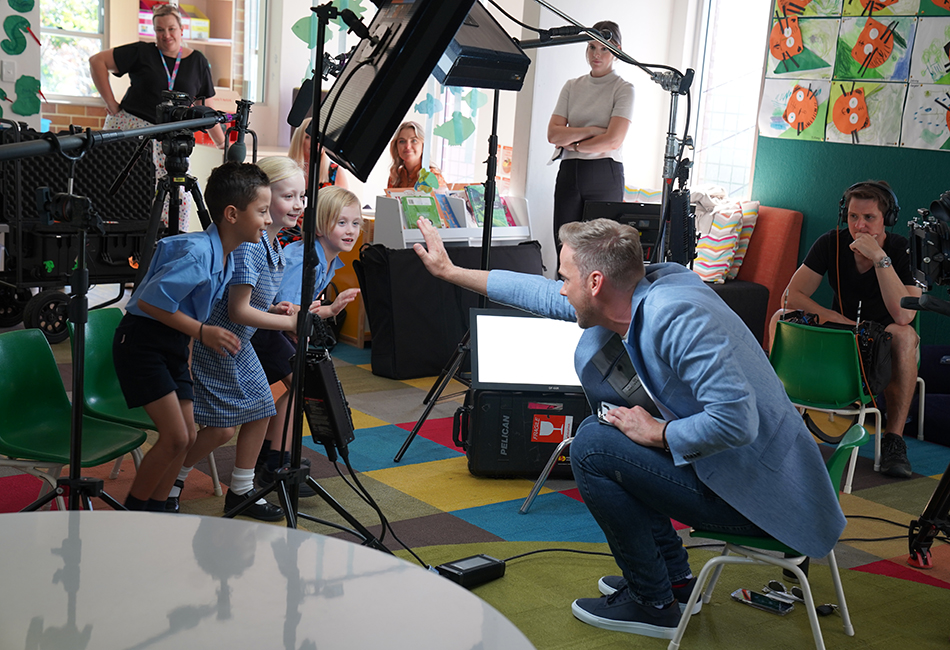 Today Presenter Tim Davies high fives St Francis de Sales Catholic Primary School Woolooware students